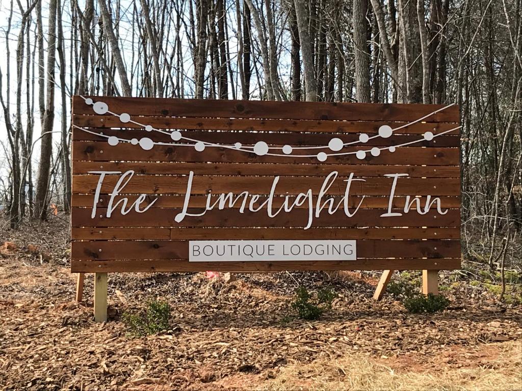 a sign for the limelight inn in the woods at The Limelight Inn in Dahlonega