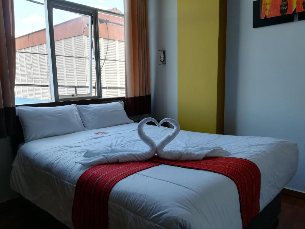 Voodi või voodid majutusasutuse Pumas Cusco Hotel toas