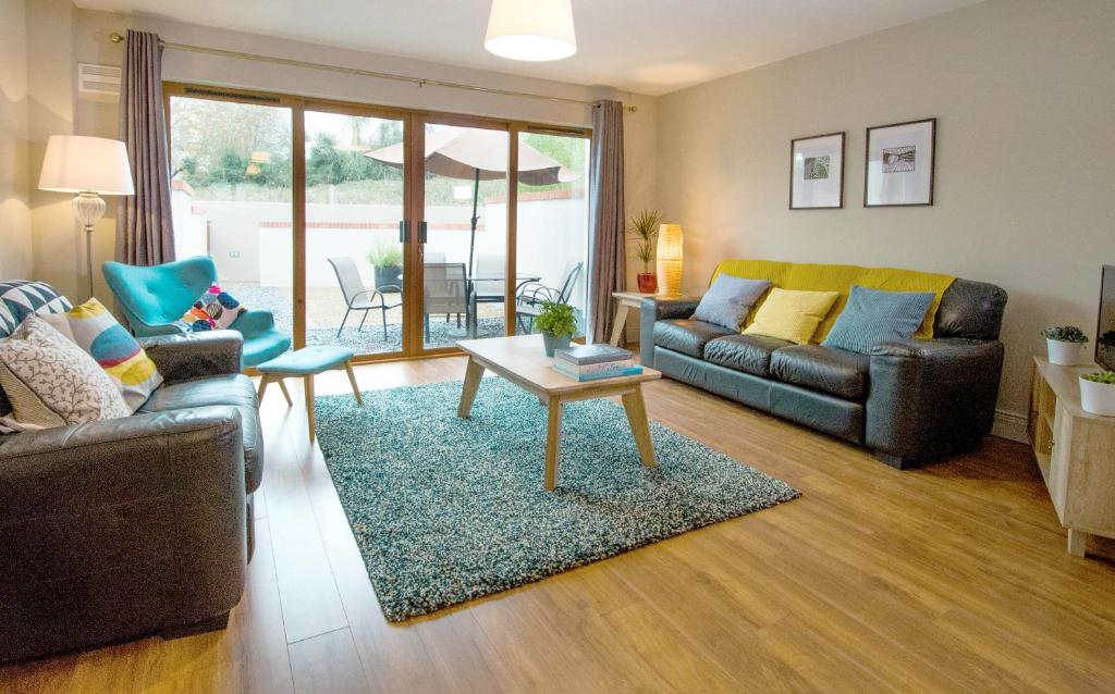a living room with a couch and a table at W8 Village in Manorhamilton