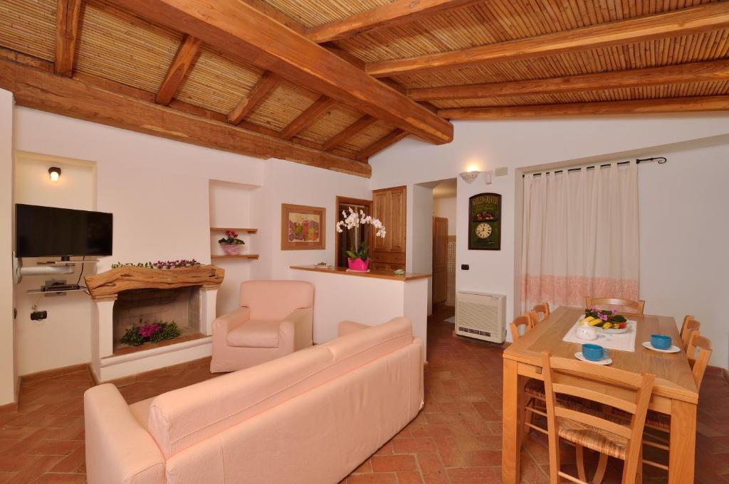A television and/or entertainment centre at Villa Isuledda Beach