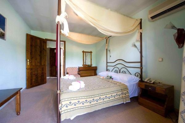 Postel nebo postele na pokoji v ubytování Lydia Hotel