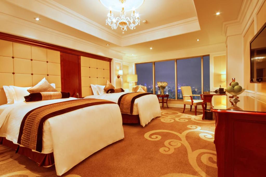 Postel nebo postele na pokoji v ubytování Kempinski Hotel Guiyang