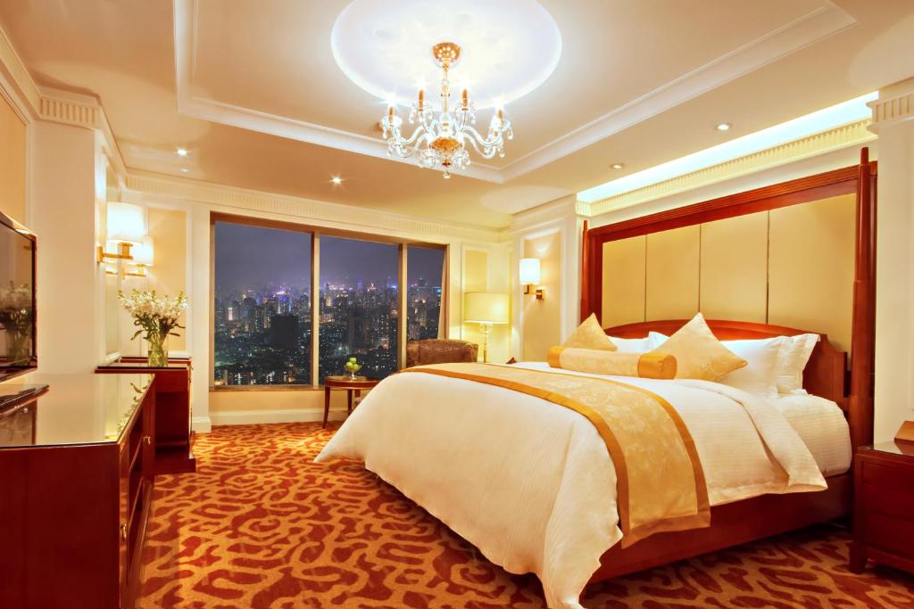 Postel nebo postele na pokoji v ubytování Kempinski Hotel Guiyang