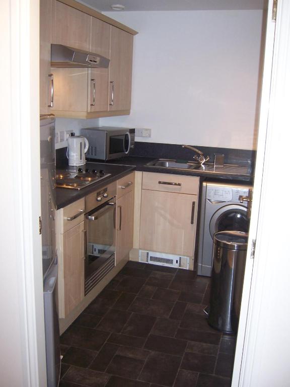 Kuchyň nebo kuchyňský kout v ubytování Livingston Business and Contractor Apartment