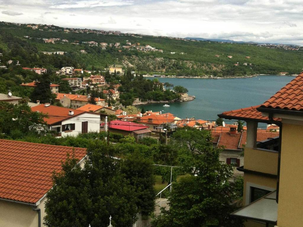 a view of a town with a body of water at Sepic Apartments in Opatija