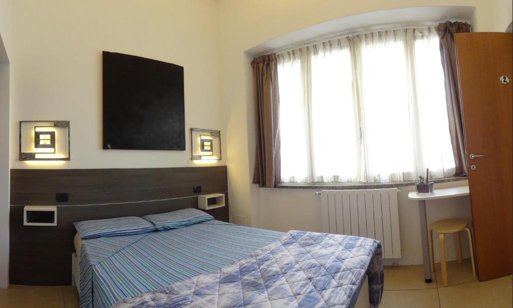 Postel nebo postele na pokoji v ubytování Prenditempo