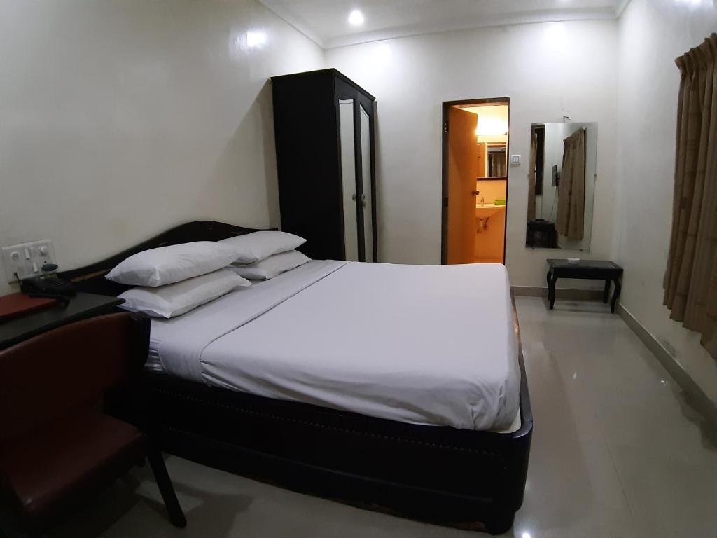 Postel nebo postele na pokoji v ubytování Hotel Ritz