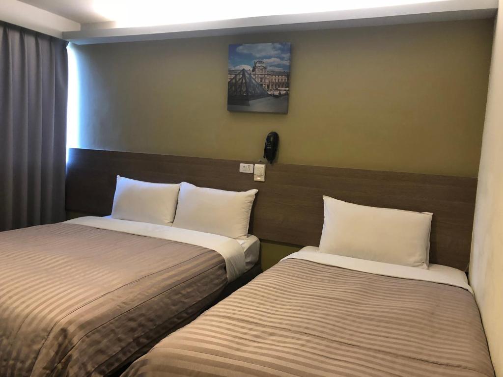 Postel nebo postele na pokoji v ubytování Chance Hotel