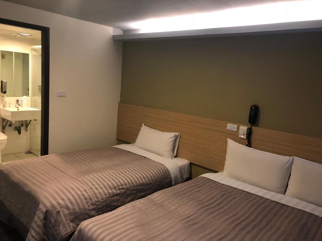 Postel nebo postele na pokoji v ubytování Chance Hotel