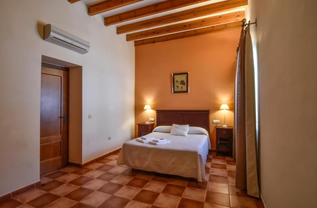 Postel nebo postele na pokoji v ubytování La Casa de Las Titas