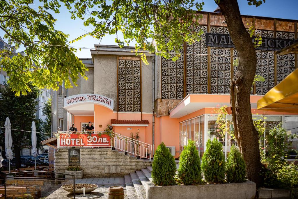 a building with a hotel sign in front of it at Family Hotel Varna in Varna City