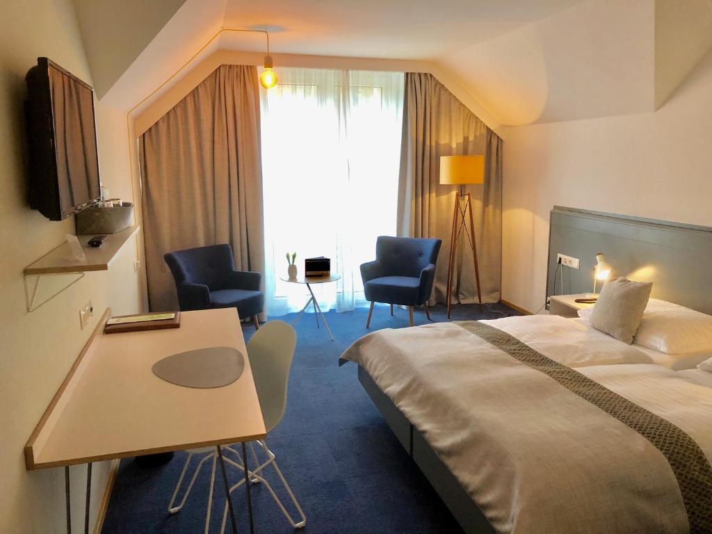 Postel nebo postele na pokoji v ubytování Hotel Restaurant Höldrichsmühle