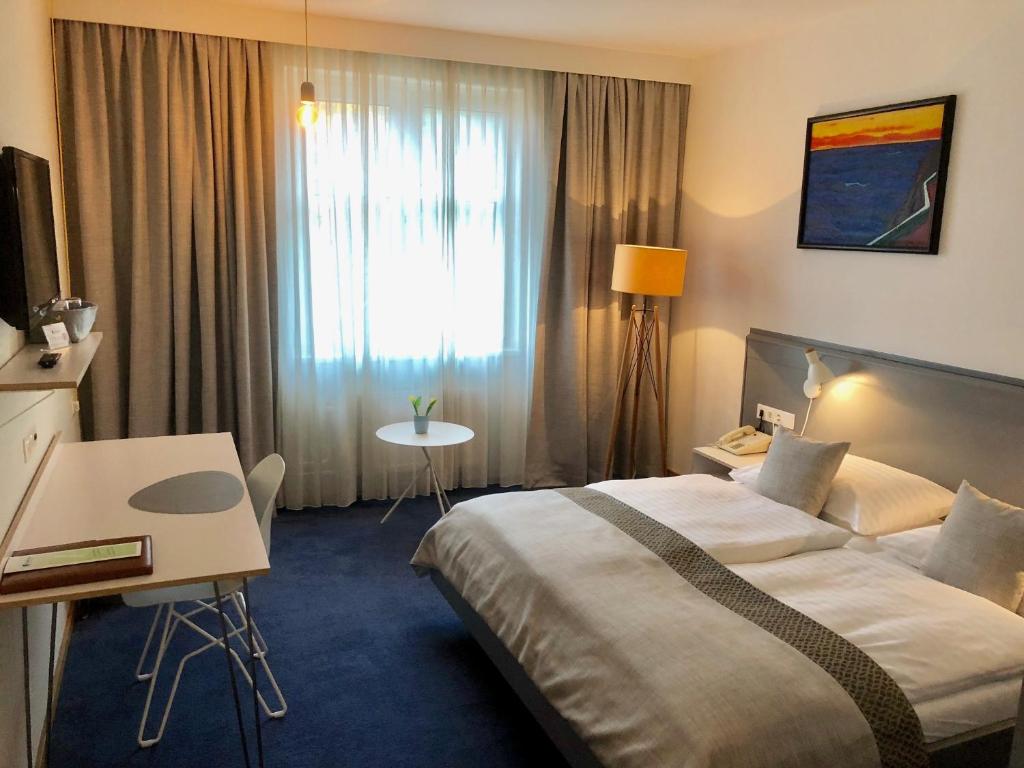 Postel nebo postele na pokoji v ubytování Hotel Restaurant Höldrichsmühle
