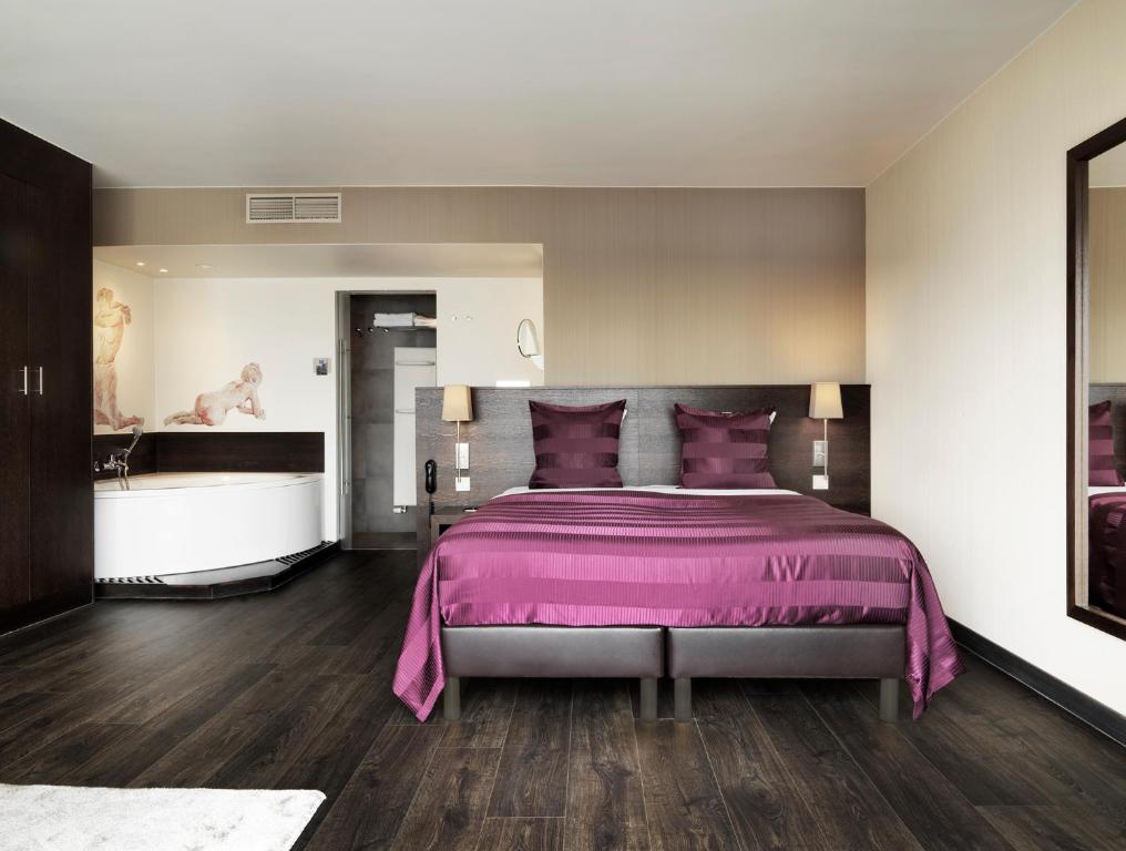 Postel nebo postele na pokoji v ubytování Hotel Harmony