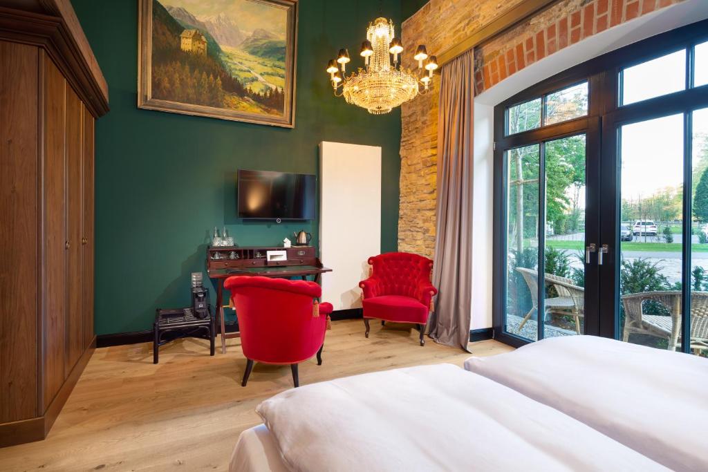 Postel nebo postele na pokoji v ubytování Hotel Rittergut Osthoff