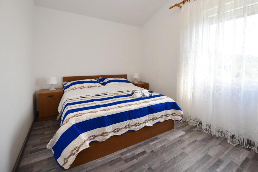 Postel nebo postele na pokoji v ubytování VAL apartmani, Stara Novalja