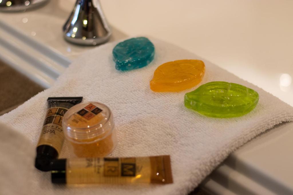 three gemstones sitting on a towel on a sink at The Kanata Fort Saskatchewan in Fort Saskatchewan