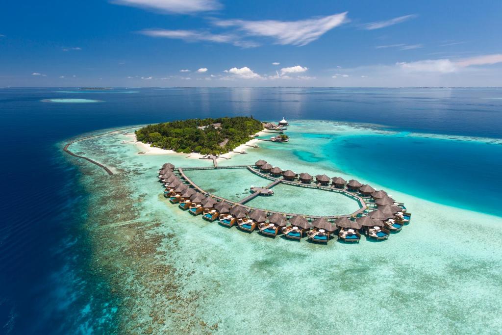 an island in the ocean with a resort at Baros Maldives in Male City