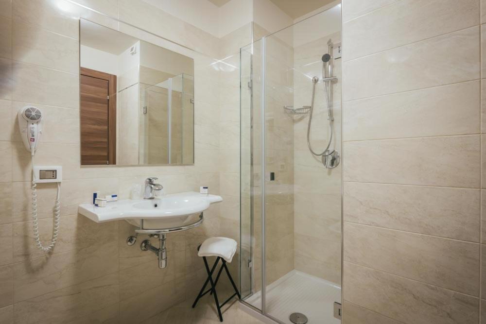a bathroom with a sink and a shower at Hotel Costa Azul in Balestrate