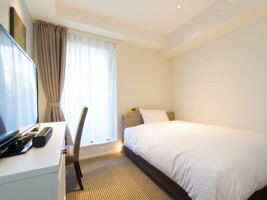 TV a/nebo společenská místnost v ubytování Hotel Shiki Utsubo Park