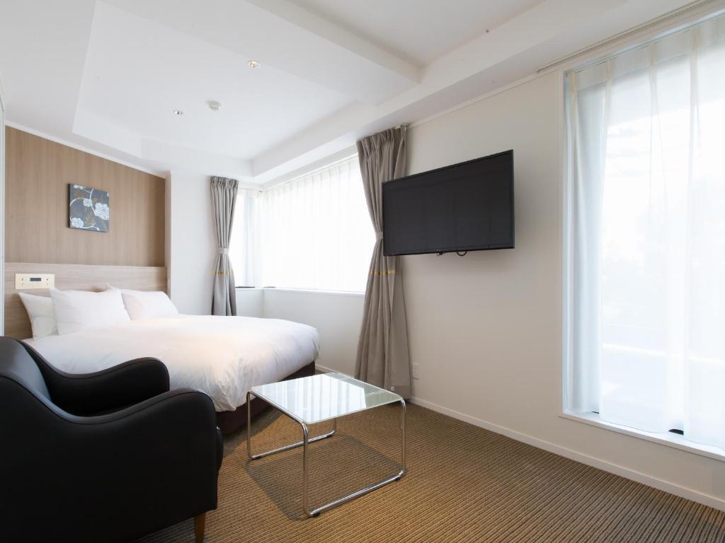 TV a/nebo společenská místnost v ubytování Hotel Shiki Utsubo Park