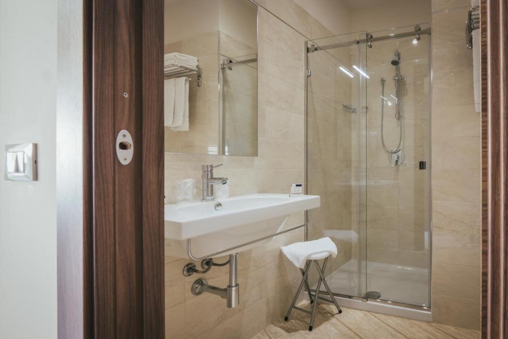 a bathroom with a sink and a shower at Hotel Costa Azul in Balestrate