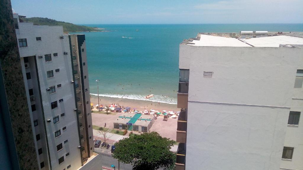a view of a beach from a building at MAR & SERRA - PRAIA do MORRO in Guarapari