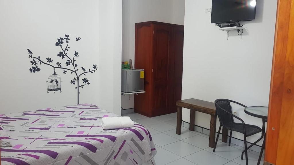 Postel nebo postele na pokoji v ubytování Hotel Las Palmas