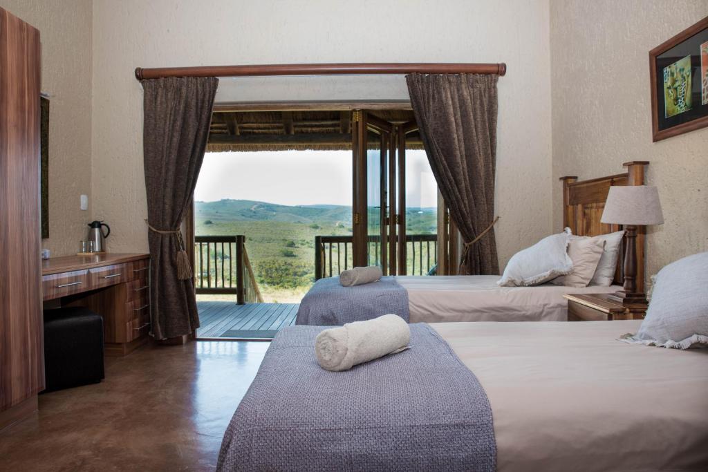 Postel nebo postele na pokoji v ubytování Hartenbos Private Game Lodge