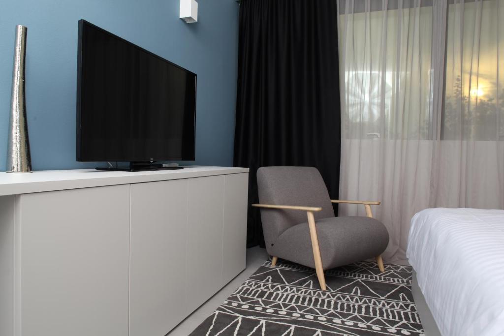 TV a/nebo společenská místnost v ubytování Hotel Cubis