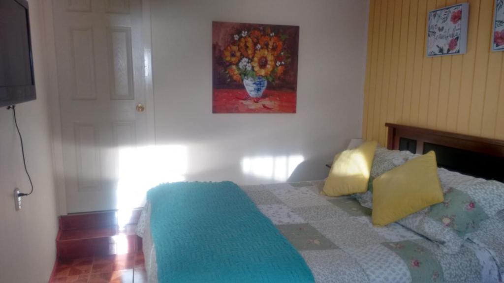 Postel nebo postele na pokoji v ubytování Hostal Miramar