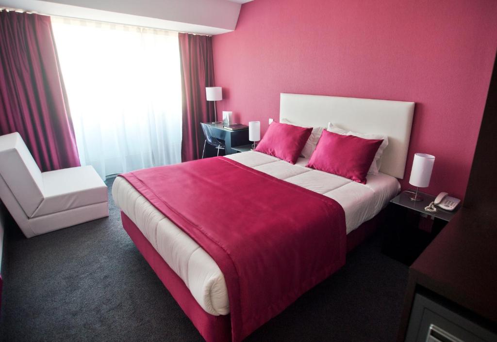 Cama ou camas em um quarto em Miramar Hotel Spa & Apartments