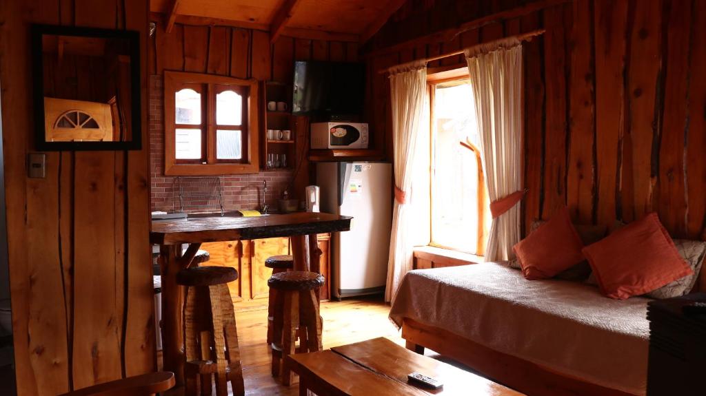 Postel nebo postele na pokoji v ubytování Cabañas Aitue