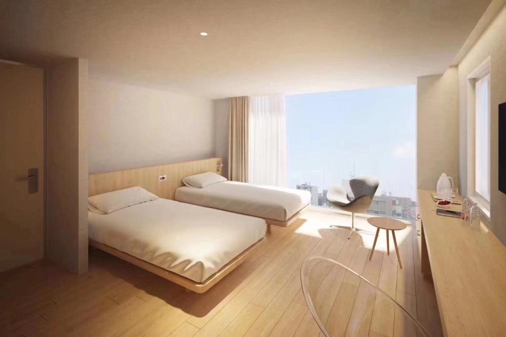 Postel nebo postele na pokoji v ubytování Hotel Comfact