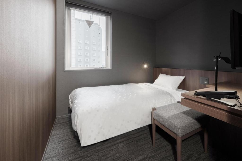 Postel nebo postele na pokoji v ubytování Hotel Comfact