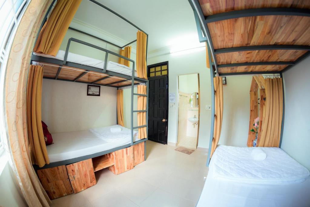 Postel nebo postele na pokoji v ubytování Rubis Hostel