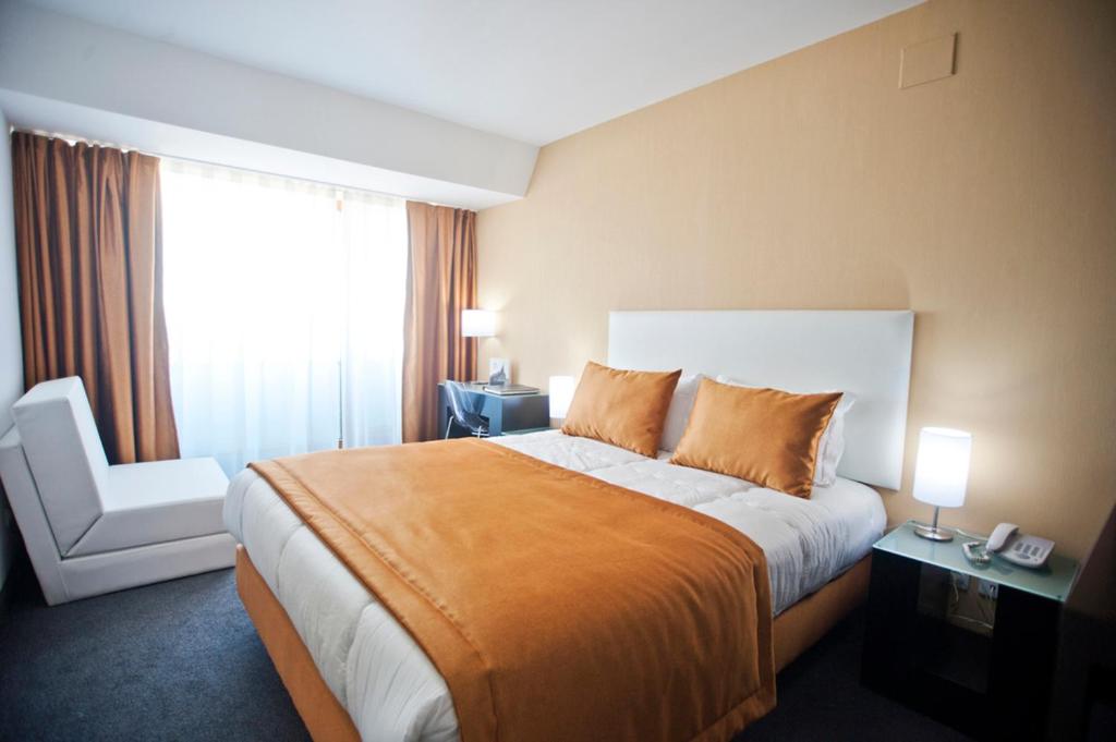 Cama ou camas em um quarto em Miramar Hotel Spa & Apartments