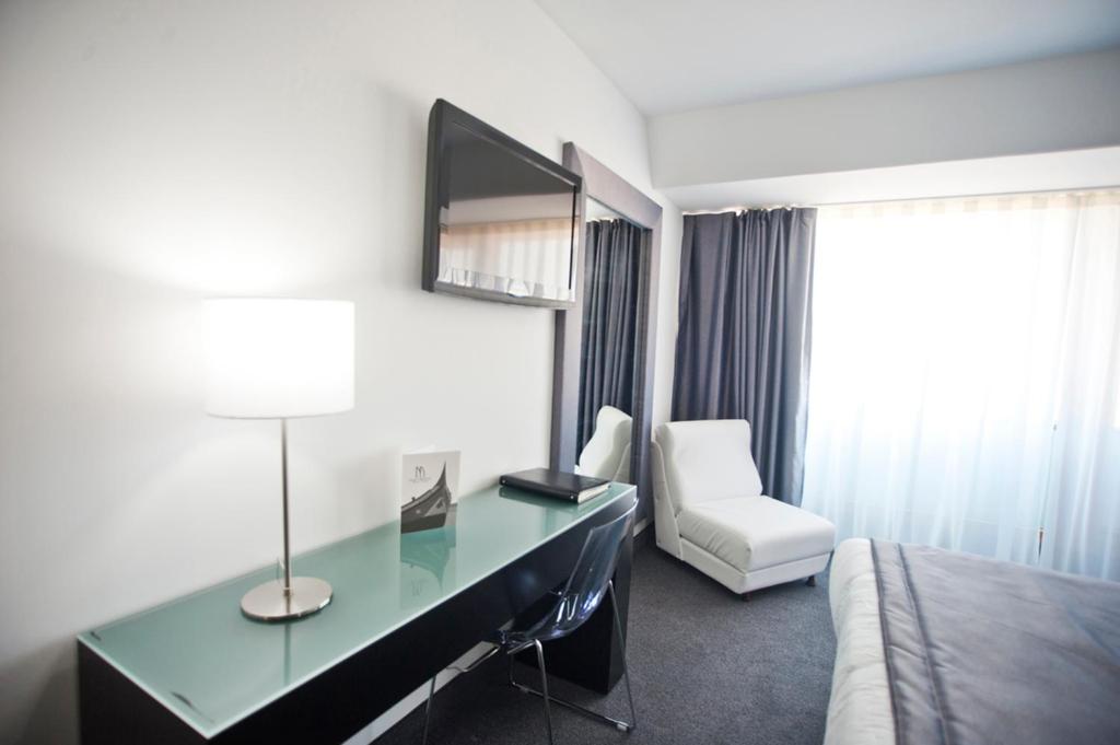 Cama ou camas em um quarto em Miramar Hotel Spa & Apartments