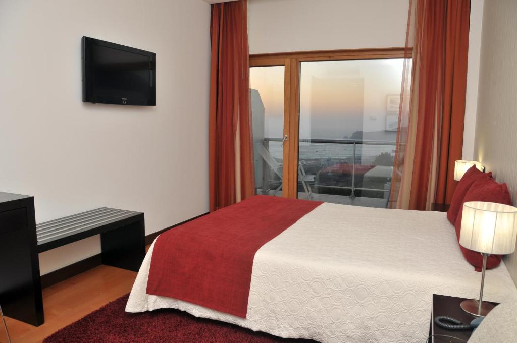 Een bed of bedden in een kamer bij Hotel Miramar Sul