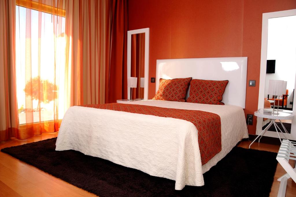 Een bed of bedden in een kamer bij Hotel Miramar Sul