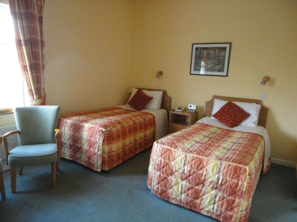 Letto o letti in una camera di Alpine Guesthouse