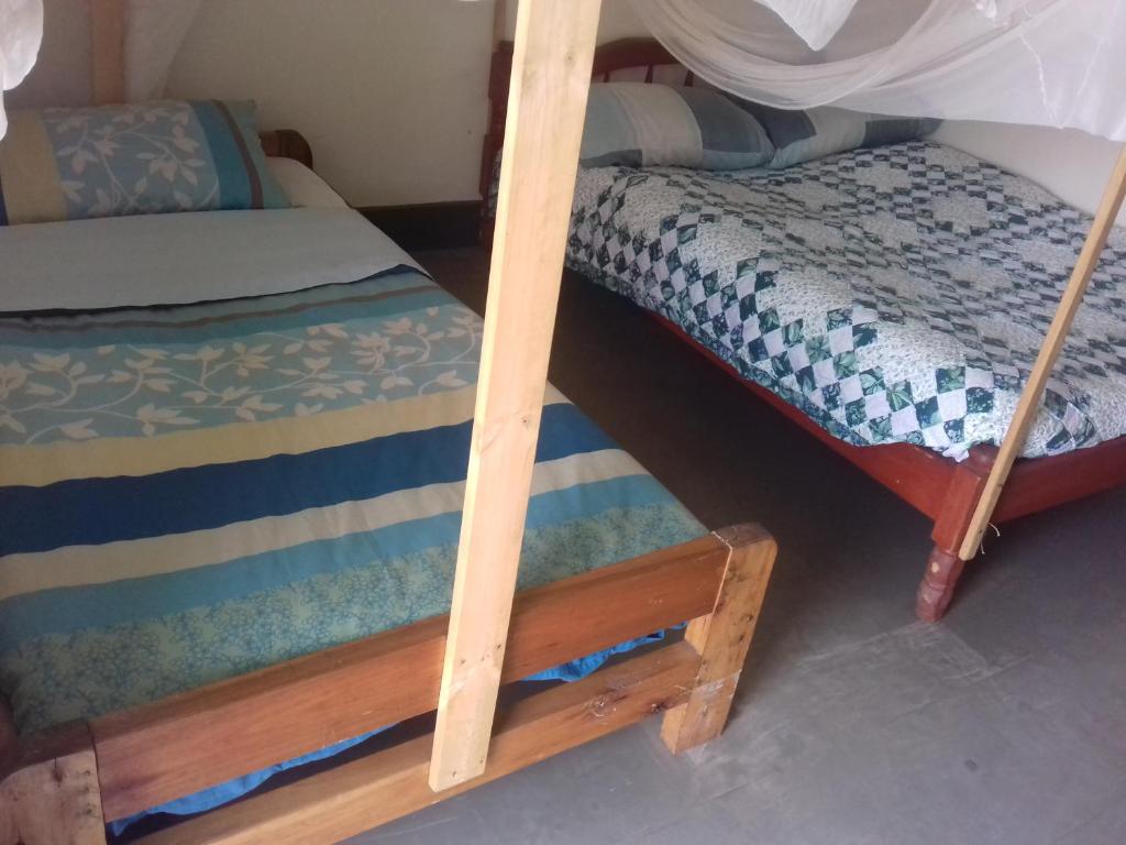a couple of bunk beds in a room at Kabale Back Packers in Kabale