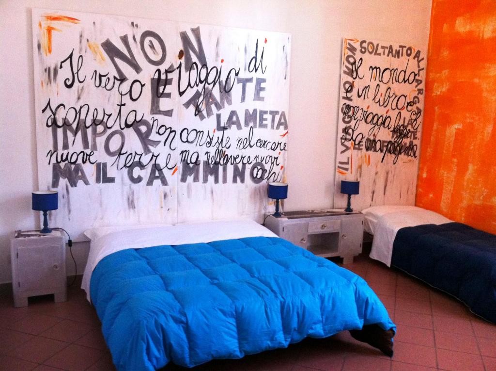 Posteľ alebo postele v izbe v ubytovaní B&B Le Lupe
