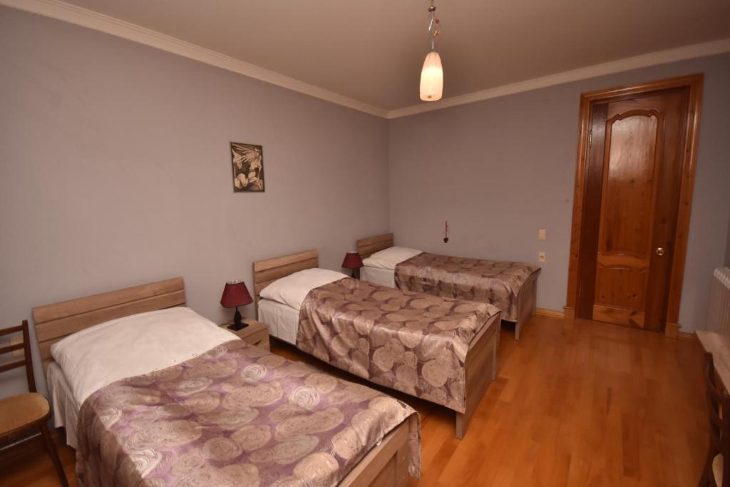 Postel nebo postele na pokoji v ubytování Guest House Green House