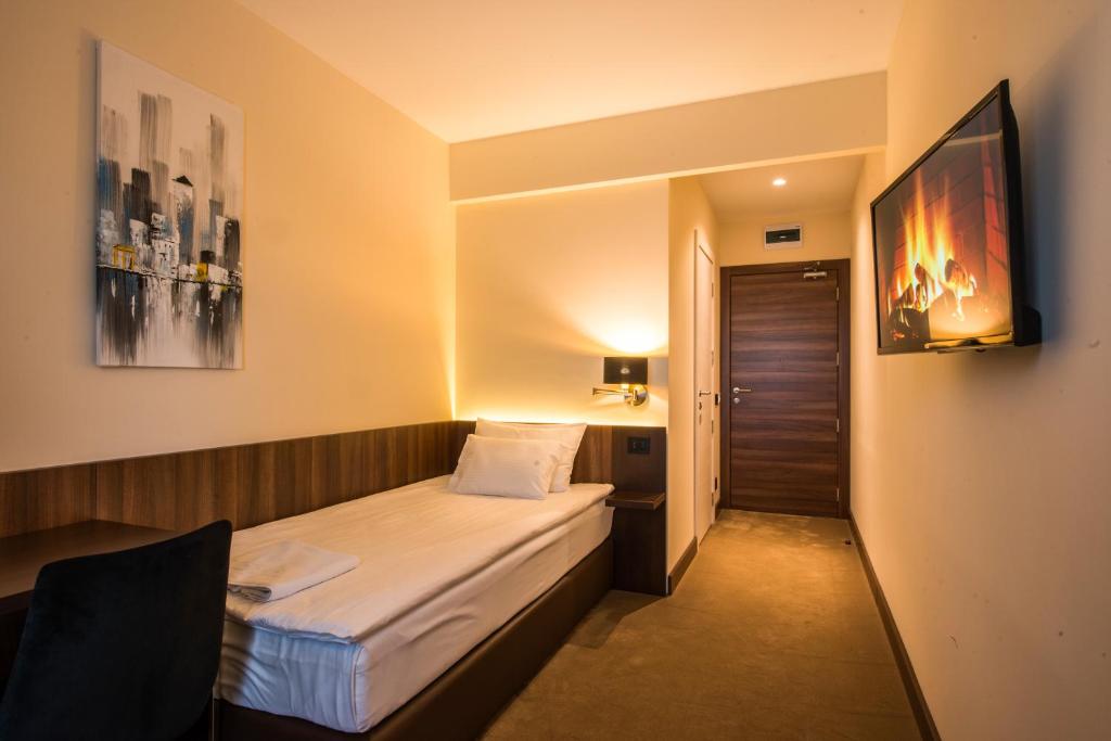 Postel nebo postele na pokoji v ubytování Hotel Spa Grad
