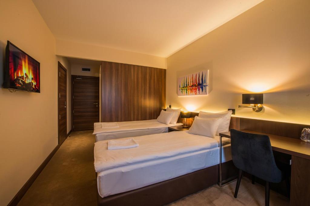 Postel nebo postele na pokoji v ubytování Hotel Spa Grad