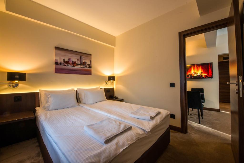 Postel nebo postele na pokoji v ubytování Hotel Spa Grad