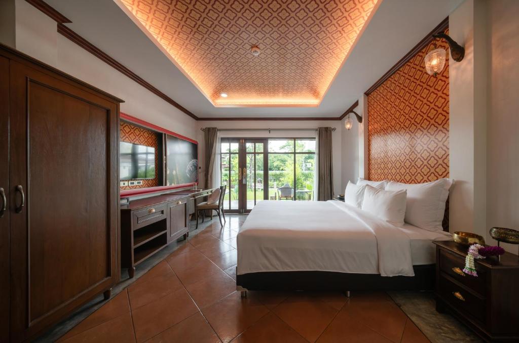 Postel nebo postele na pokoji v ubytování Kasayapi Hotel