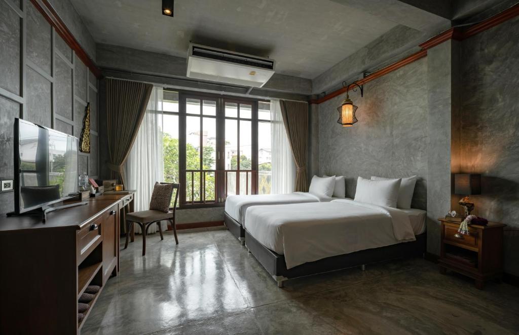 Postel nebo postele na pokoji v ubytování Kasayapi Hotel