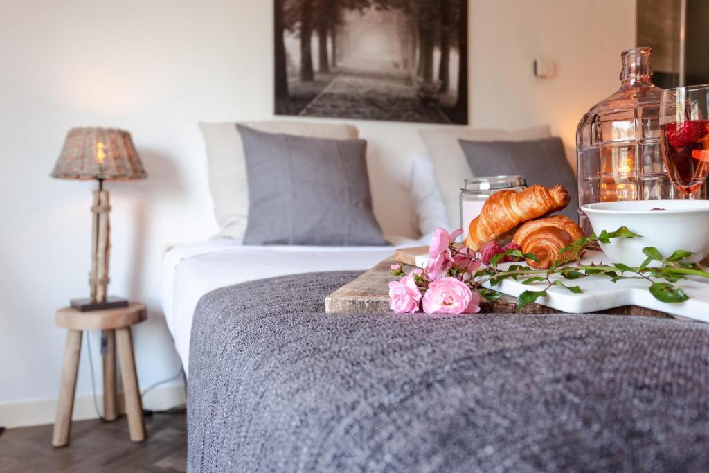 Postel nebo postele na pokoji v ubytování Hajé Restaurant de Aalscholver